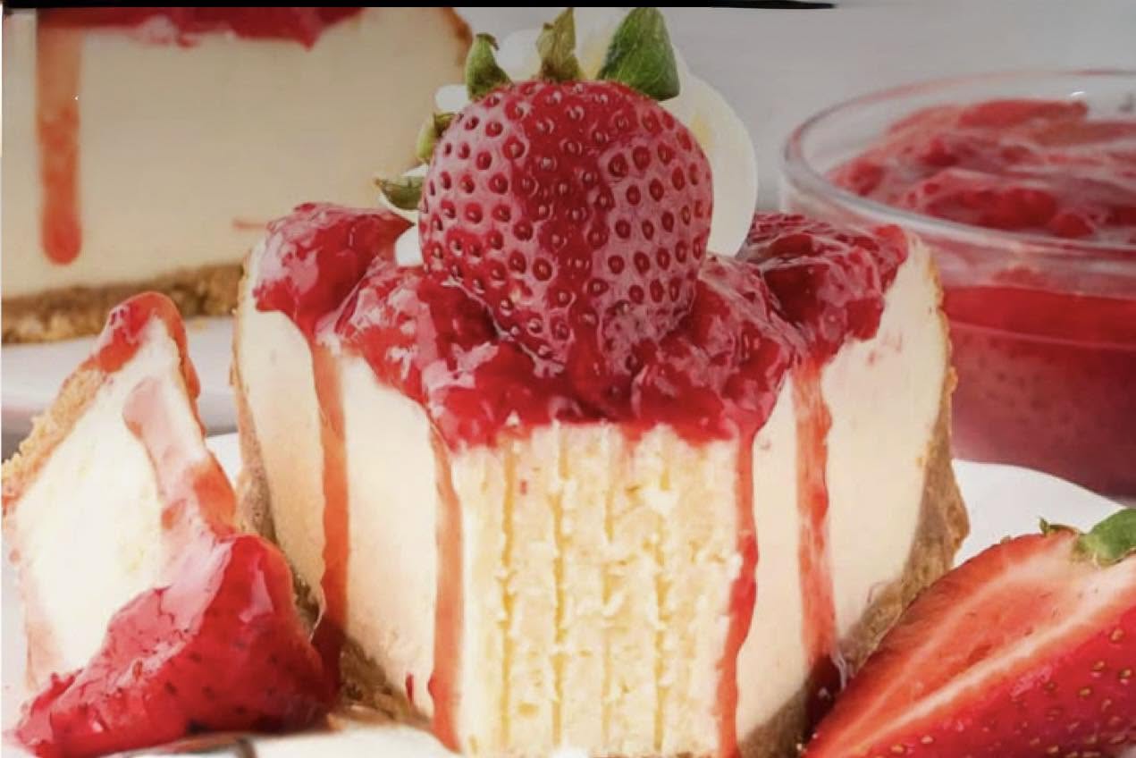 Strawberry cheesecake topped with fresh berries
