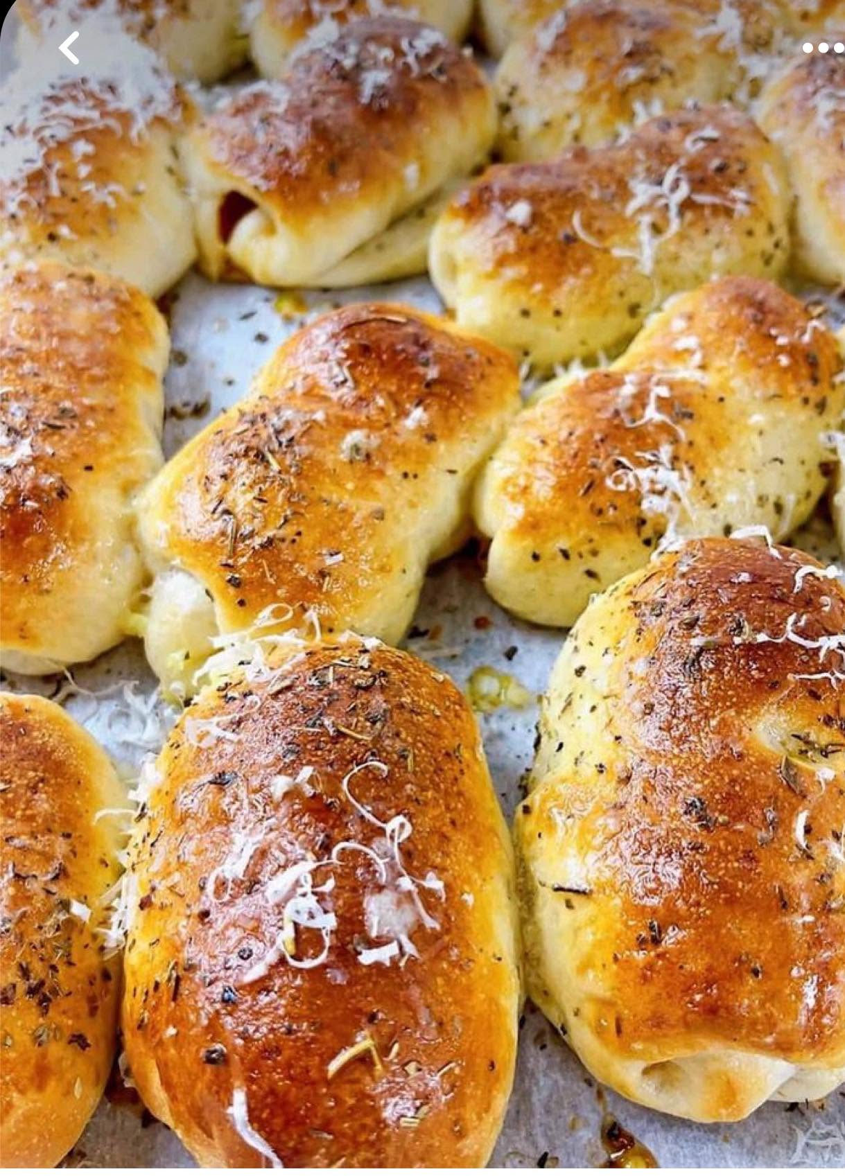 Freshly baked pepperoni rolls with herbs and cheese