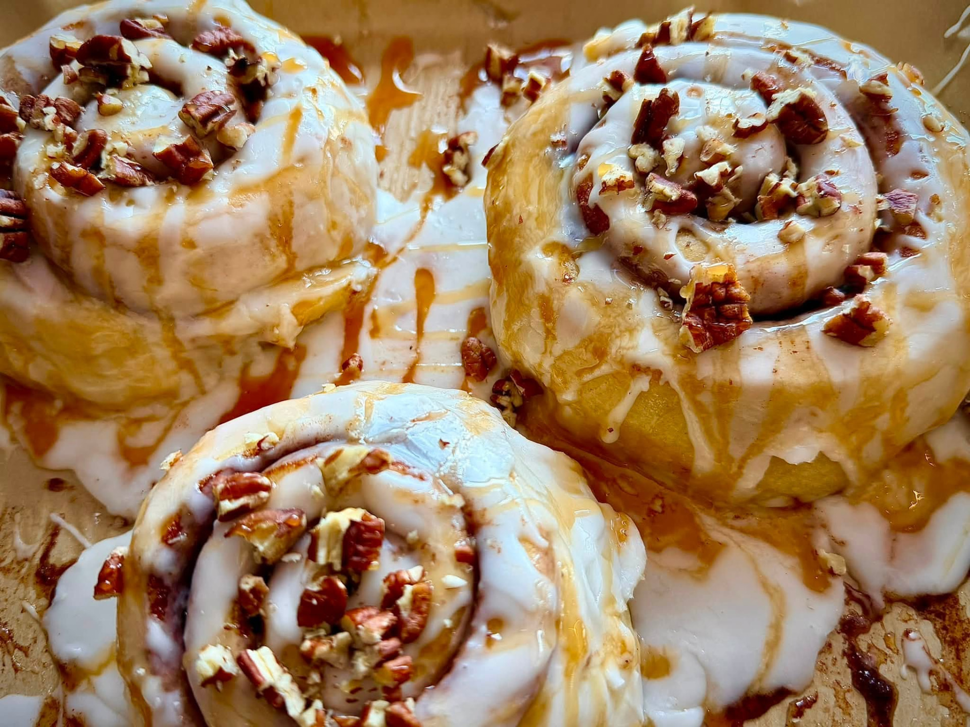 Freshly iced pecan cinnamon rolls