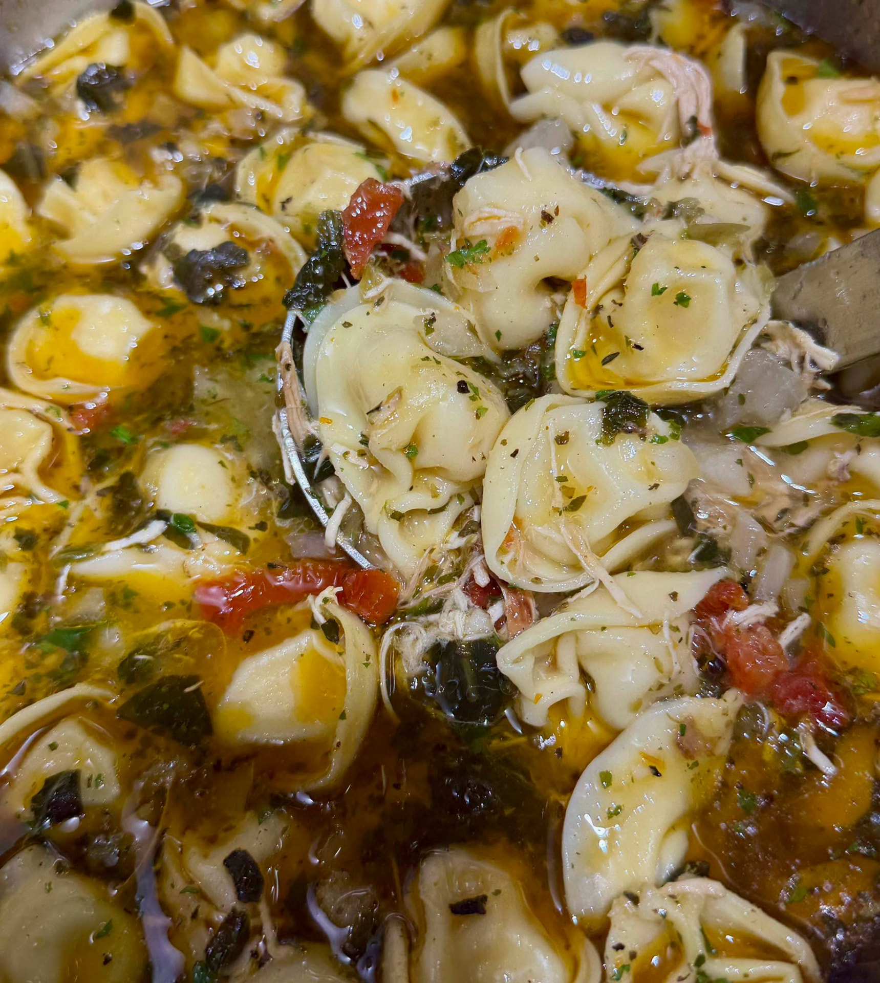 Homemade tortellini soup with chicken and vegetables