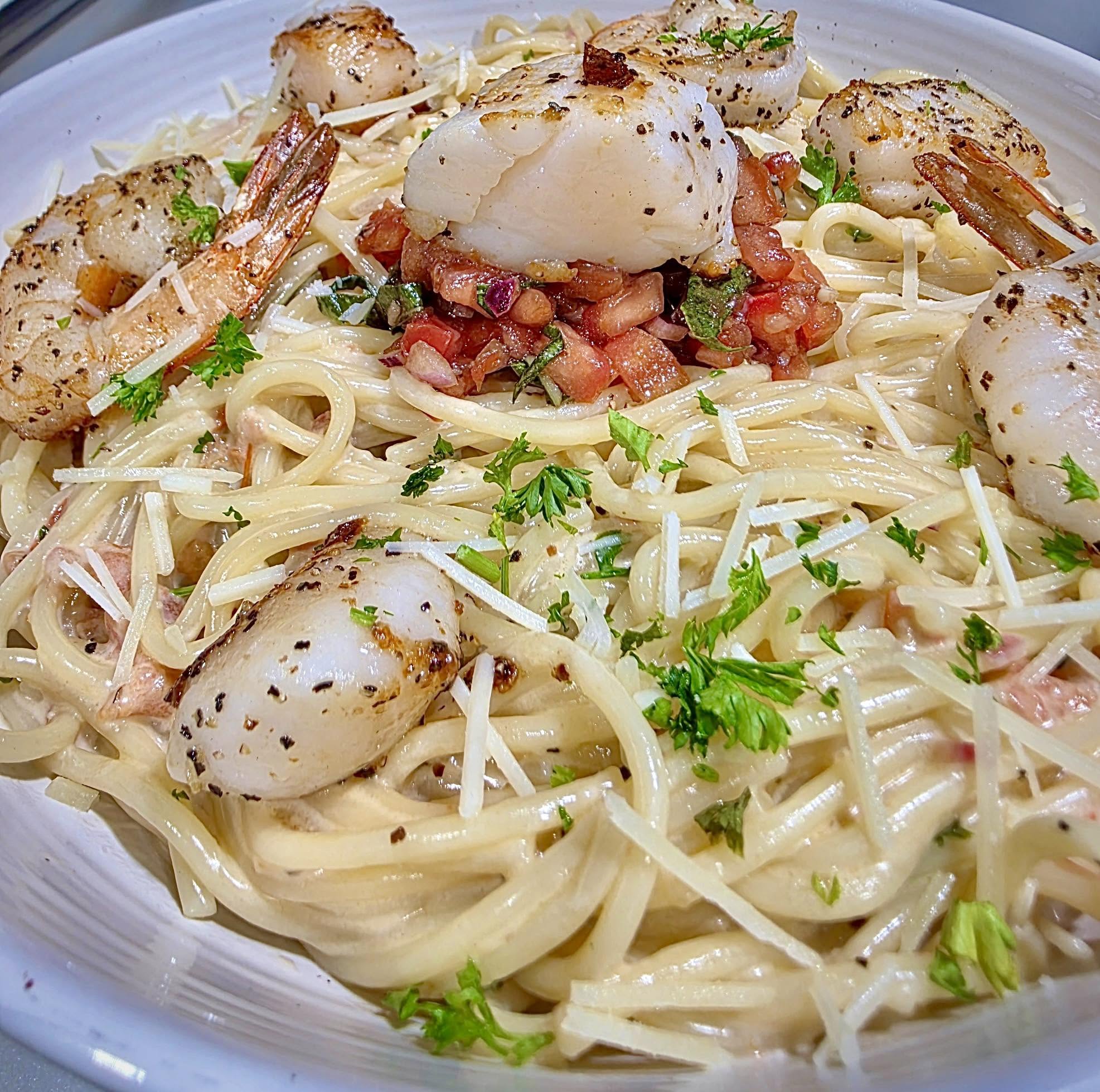 Creamy pasta with seafood and fresh herbs